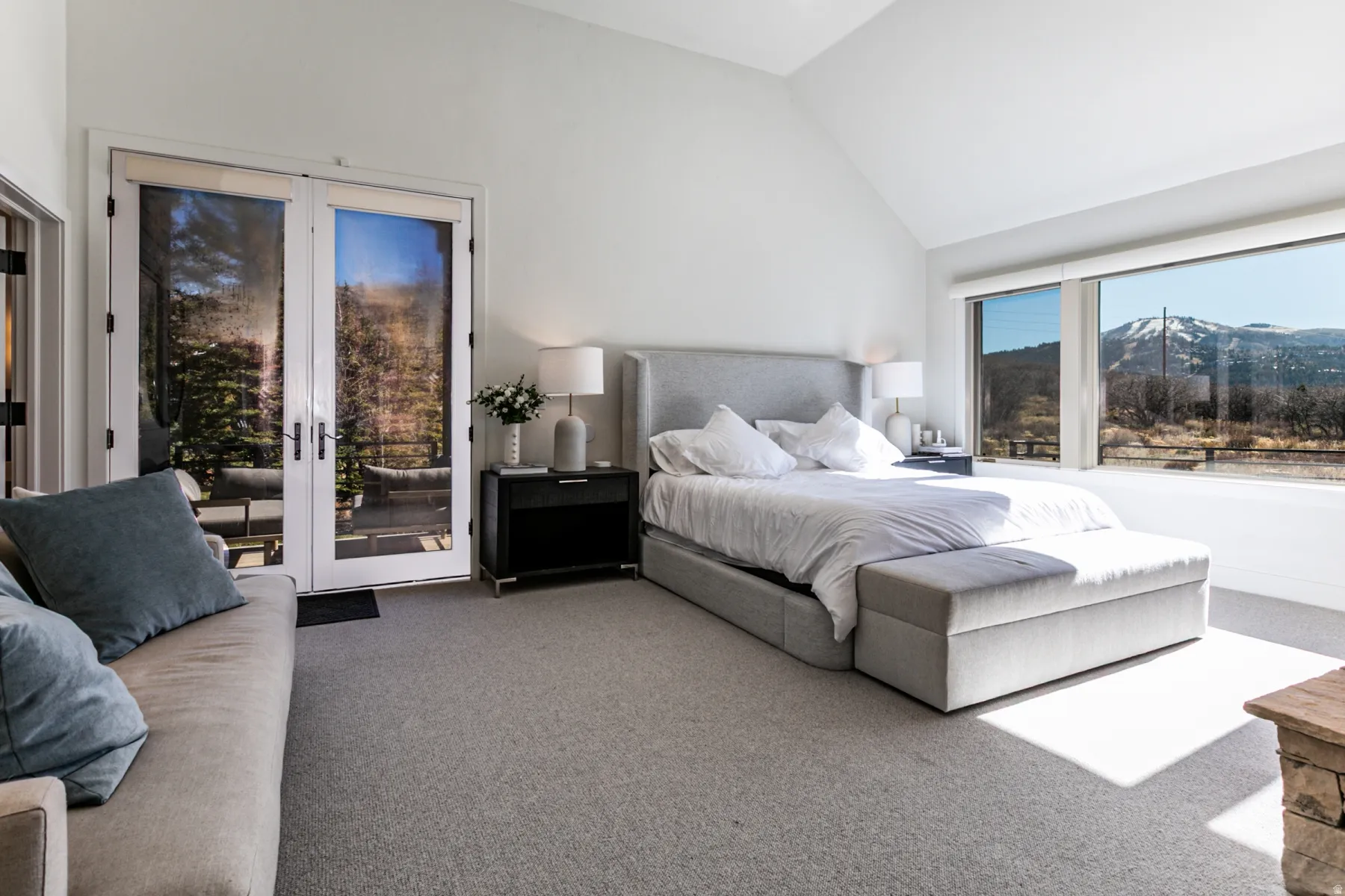 Bedroom featuring carpet, a mountain view, access to exterior, french doors, and high vaulted ceiling