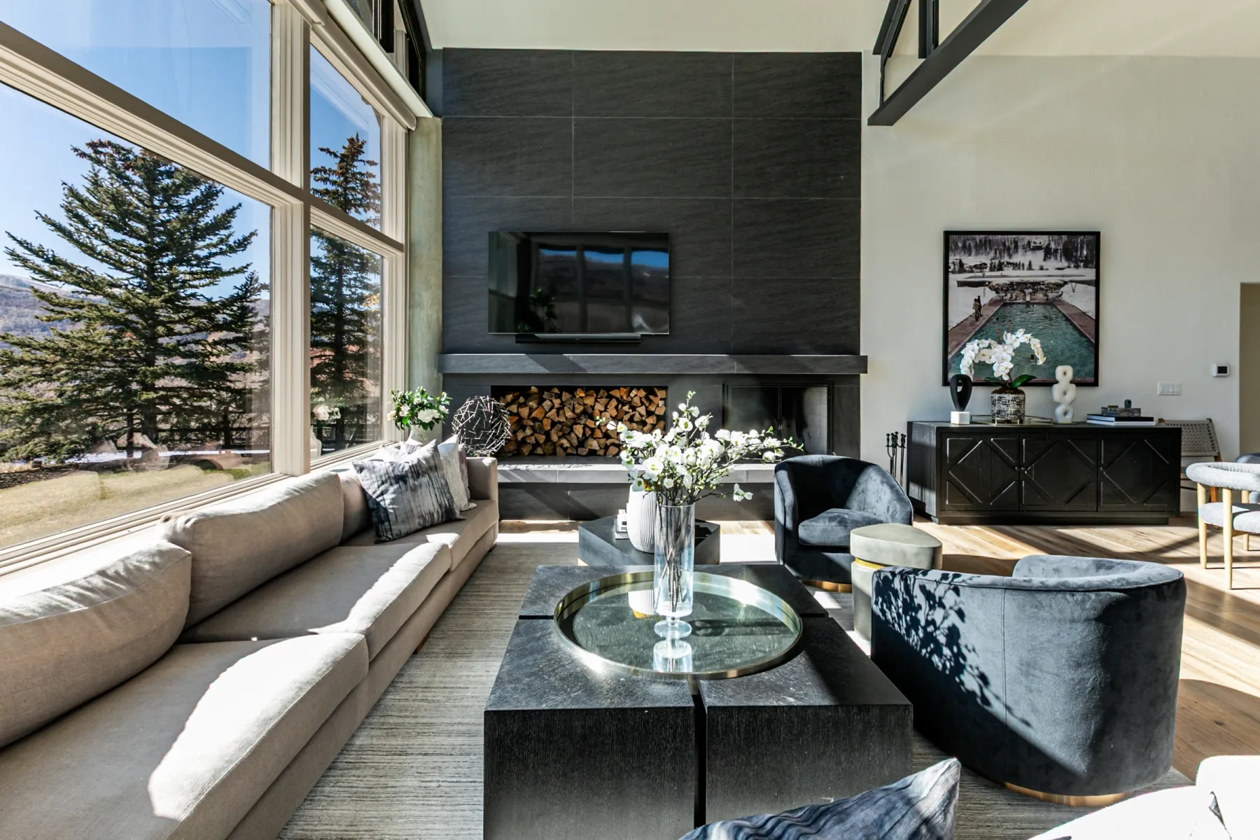 Living room with wood finished floors and a high ceiling