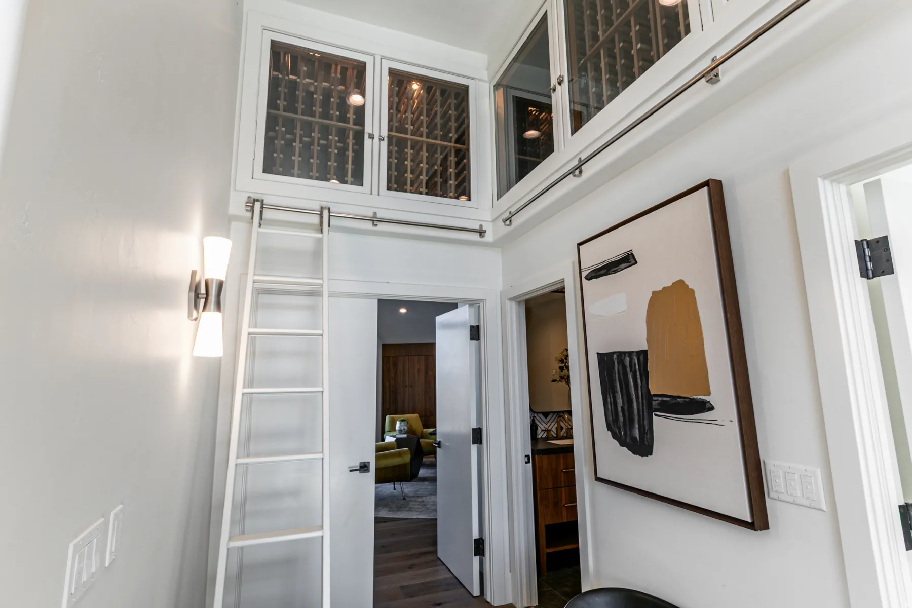 Corridor with dark wood-style flooring and a towering ceiling