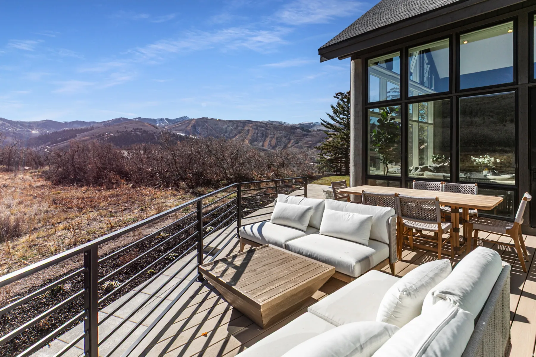 Balcony featuring a mountain view, outdoor lounge area, and outdoor dining area