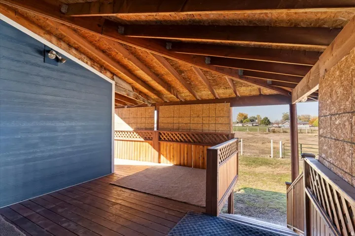 Wooden terrace featuring a view of countryside