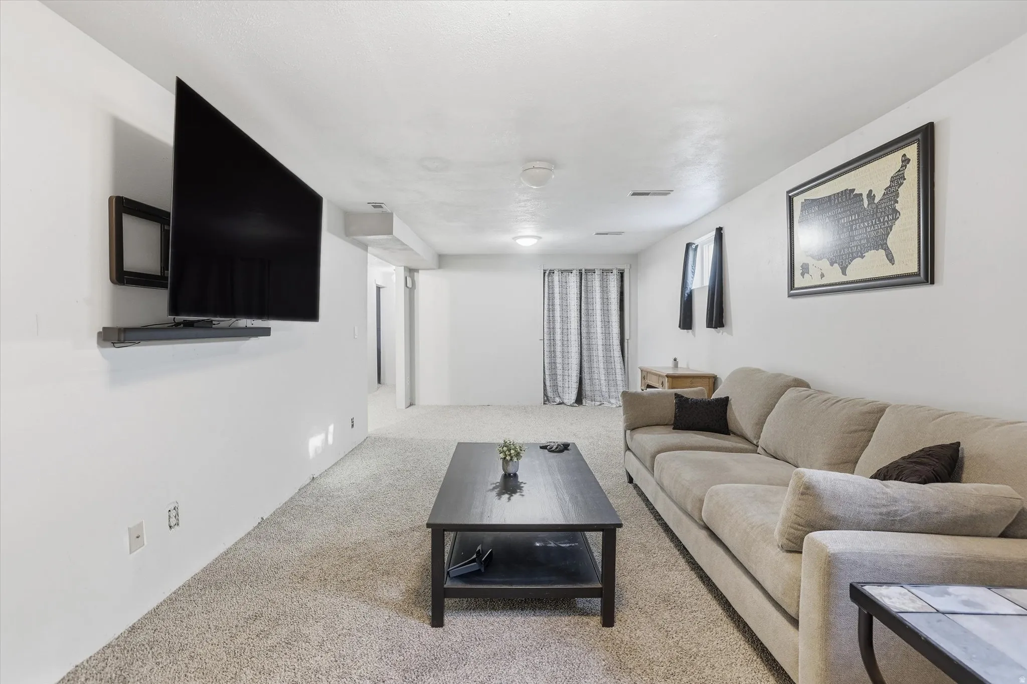 Living area featuring carpet flooring