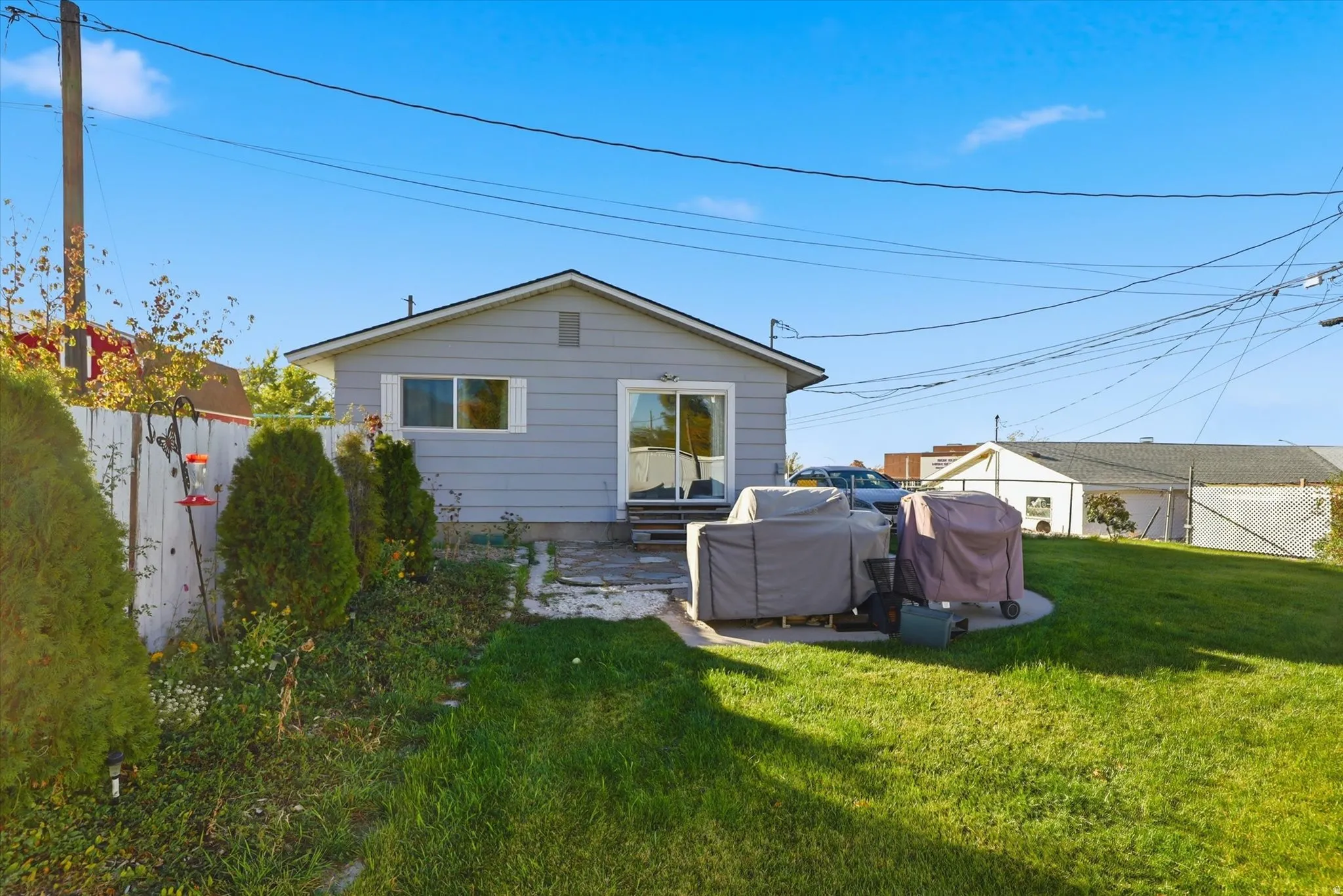Rear view of property featuring a patio