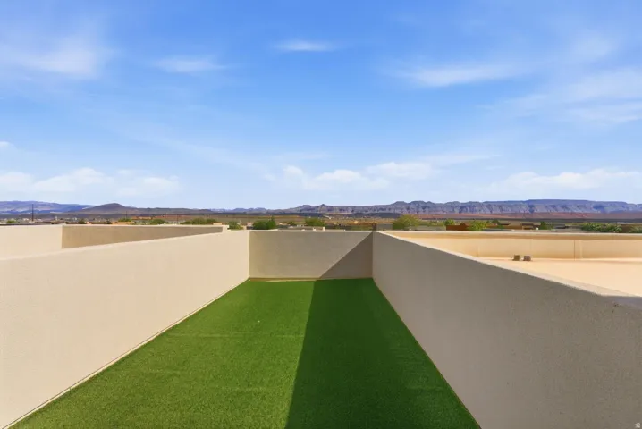 View of yard with a mountain view and a patio