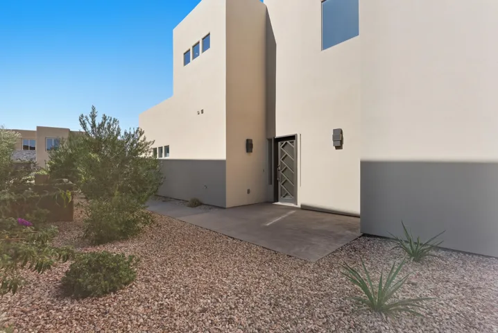 Back of property featuring stucco siding