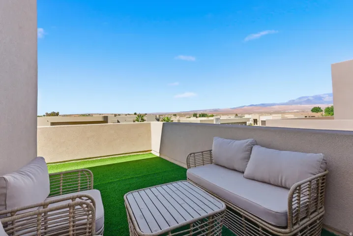View of patio featuring an outdoor living space and a mountain view