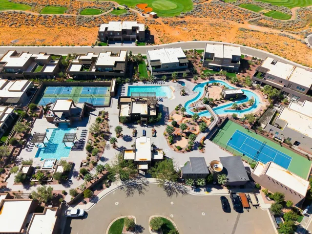 View of property location with a pool and a golf club
