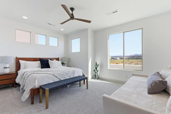 Bedroom with carpet flooring, ceiling fan, and recessed lighting