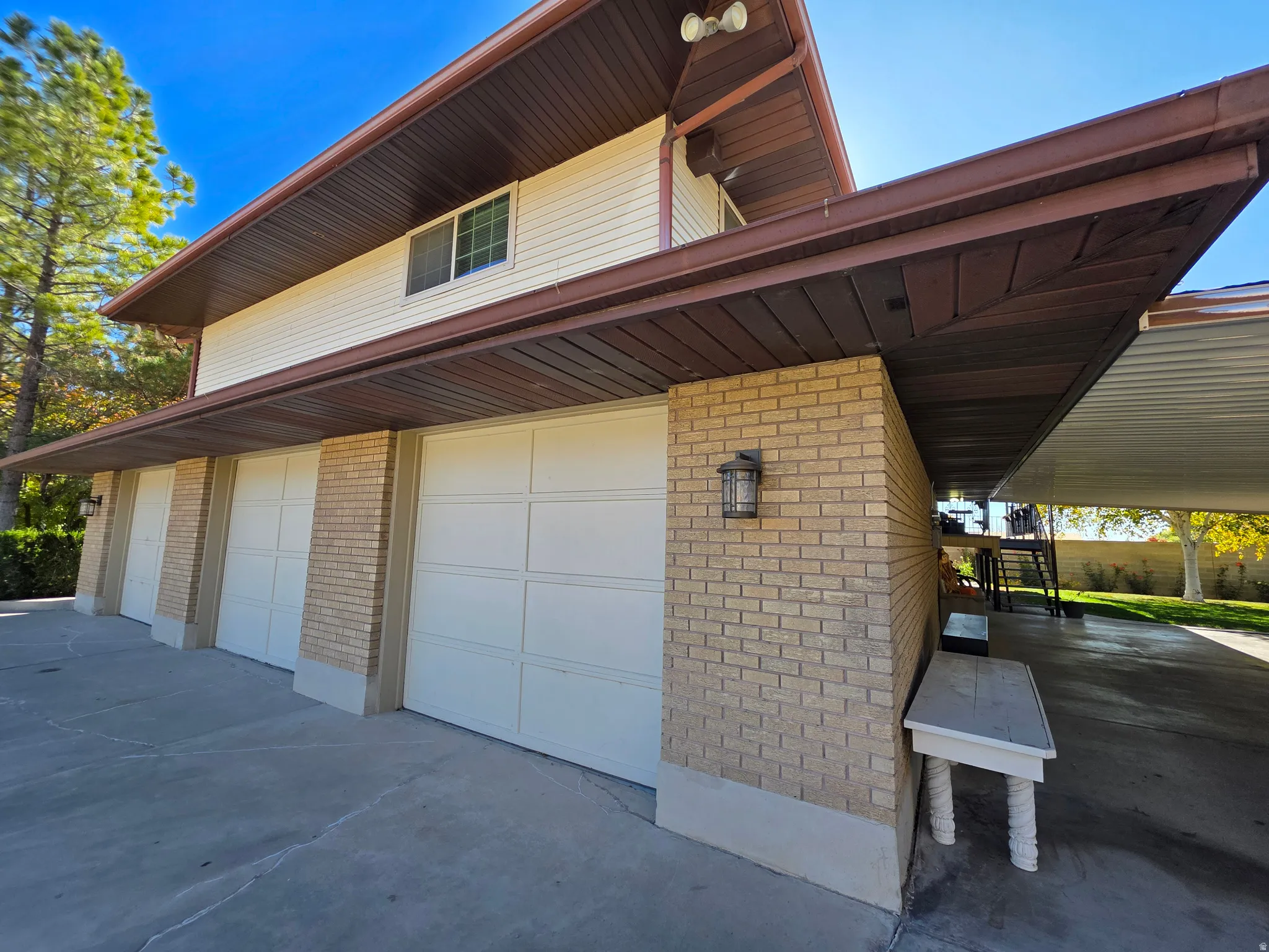 Garage featuring concrete driveway