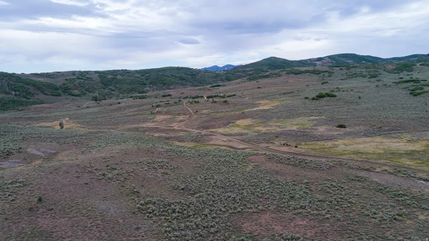 View of mountain background featuring rural landscape