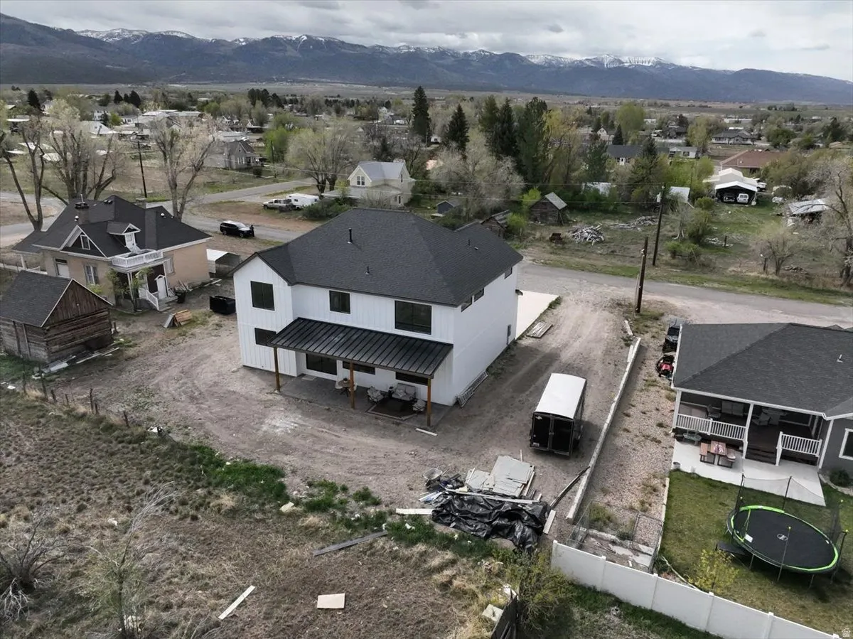 Aerial view of residential area featuring a mountain backdrop