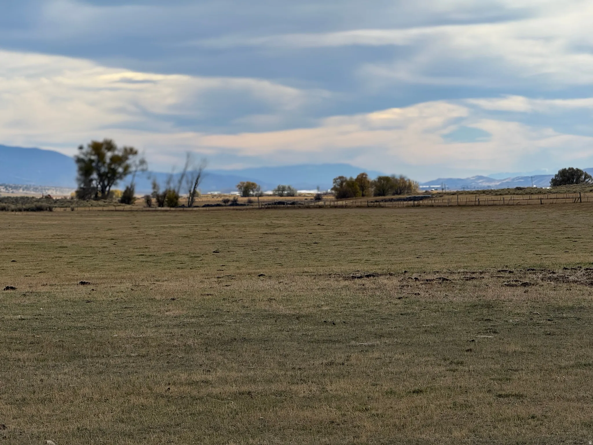 View of green lawn featuring a view of countryside and a mountain view