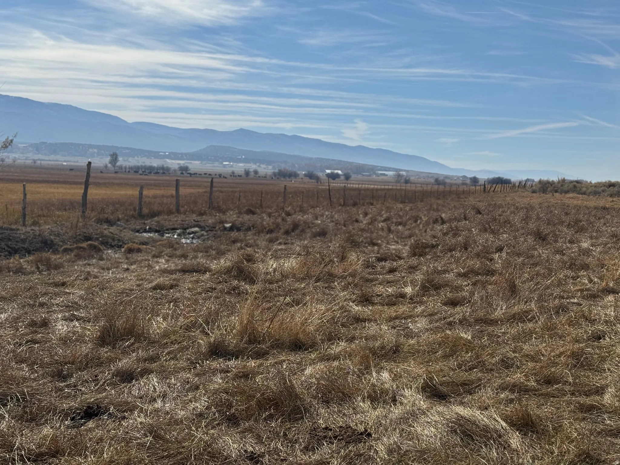 View of mountain background featuring rural landscape