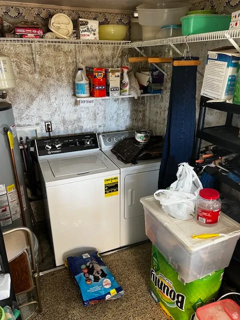 Laundry area featuring separate washer and dryer and water heater