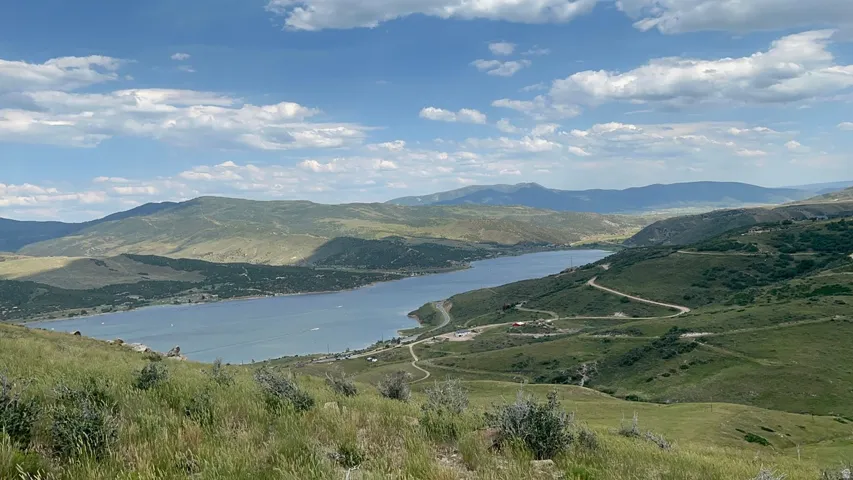 View of mountain backdrop with a nearby body of water
