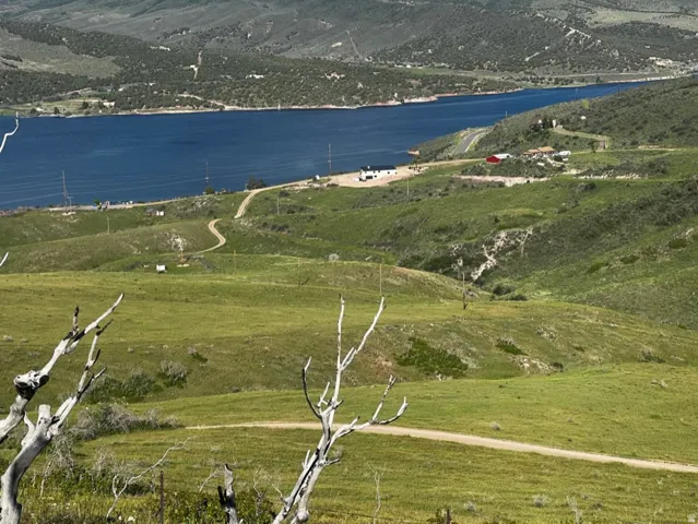 Aerial view of sparsely populated area with a water and mountain view