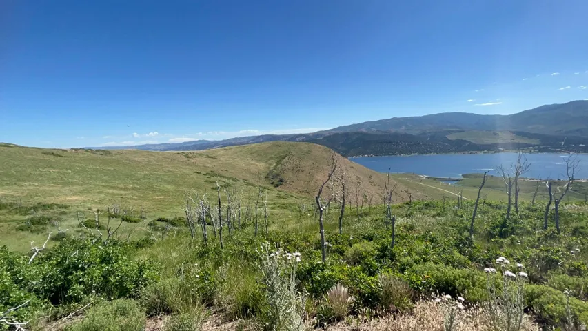 View of mountain backdrop with a large body of water