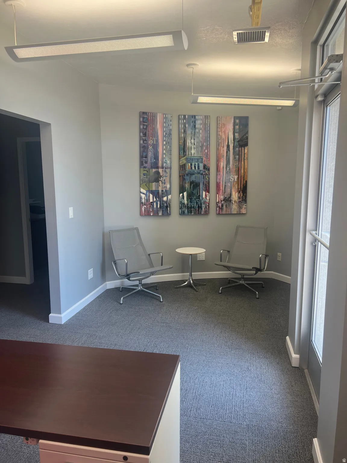 Unfurnished room featuring carpet floors and baseboards