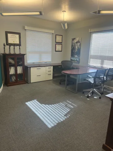 Office featuring dark colored carpet