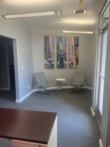Unfurnished room featuring carpet floors and baseboards