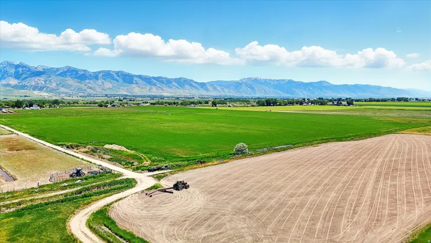 Overview of farmland featuring a mountain backdrop