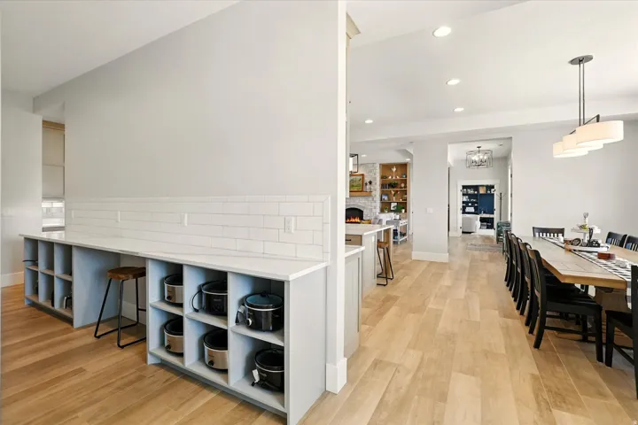 Prep-Kitchen featuring tasteful backsplash, open shelves, recessed lighting, pendant lighting, and light wood-style floors