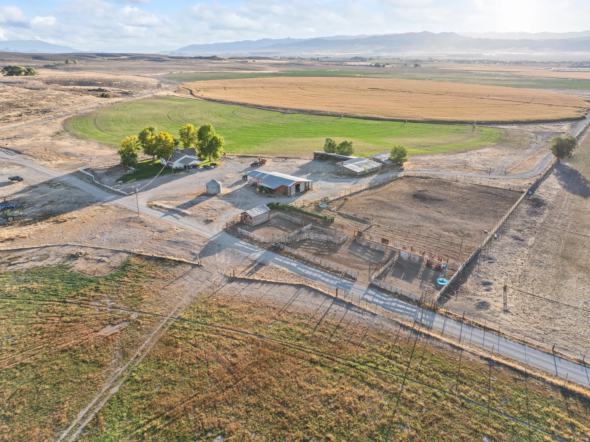 Aerial overview of property's location with rural landscape and mountains