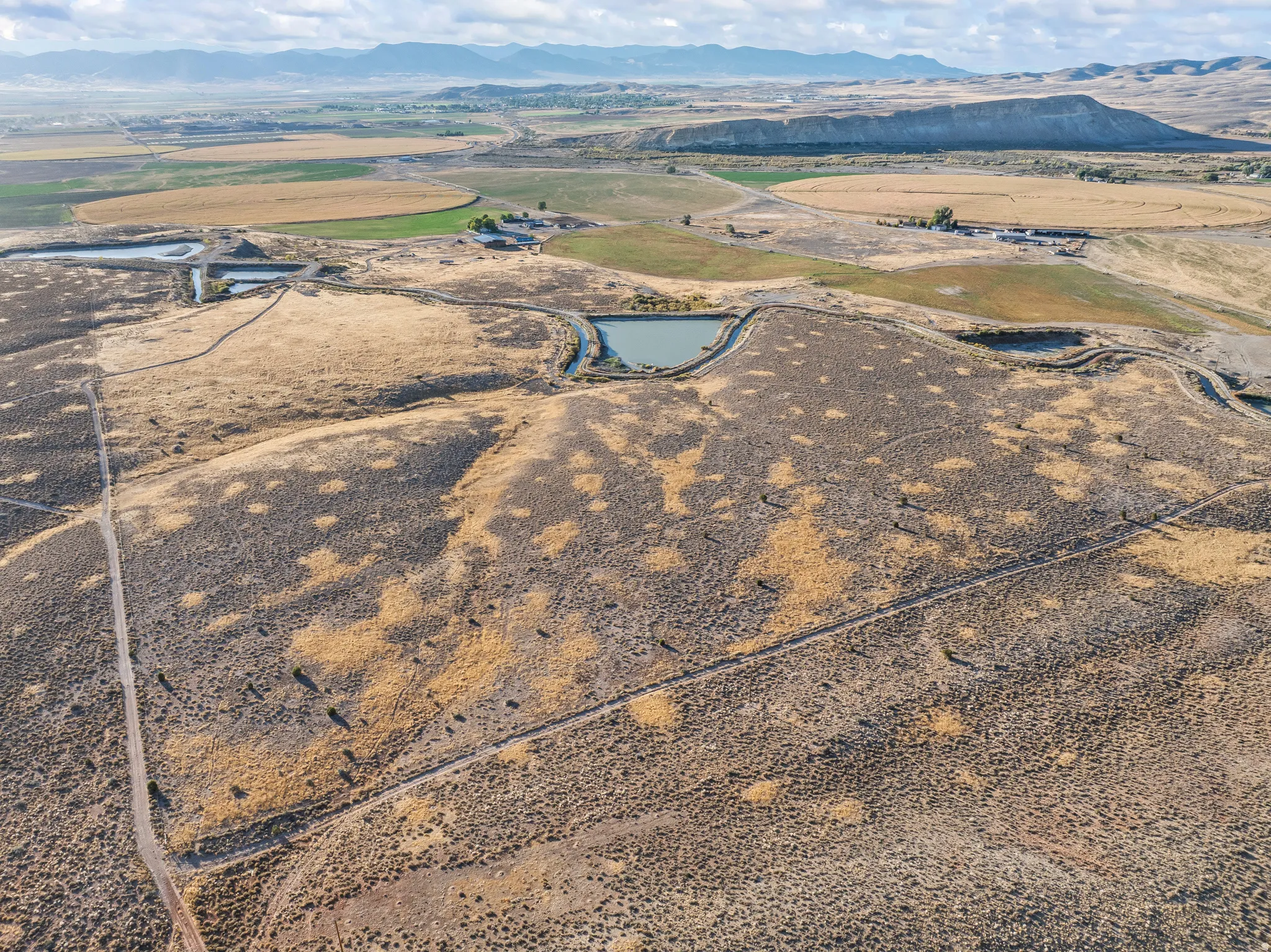 Overview of rural landscape with a mountainous background