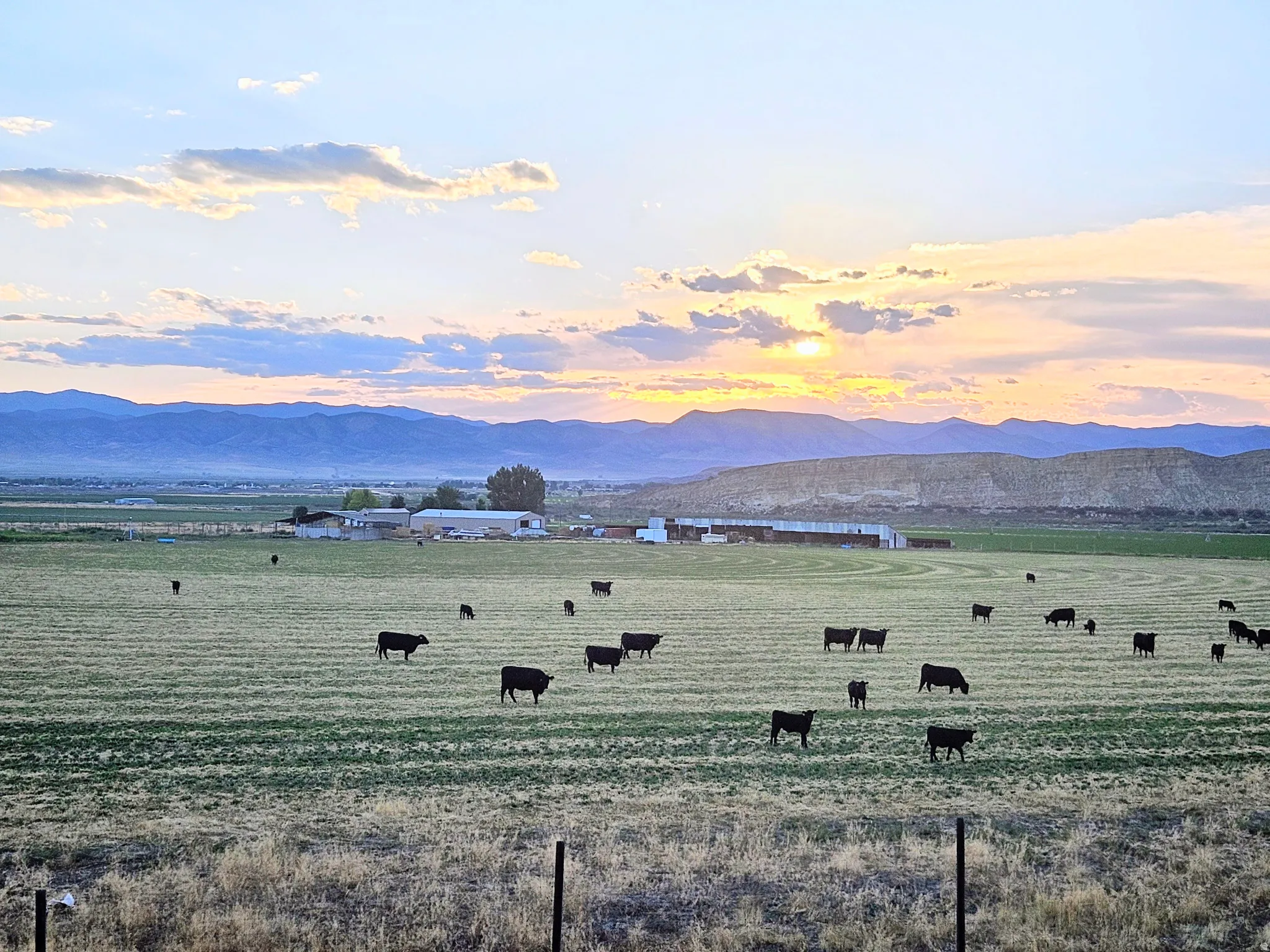 View of mountain background featuring agricultural land and rural landscape