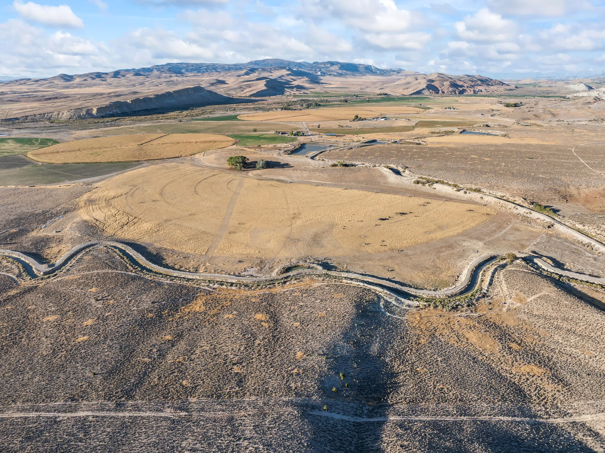 Aerial view of property's location with mountains and rural landscape