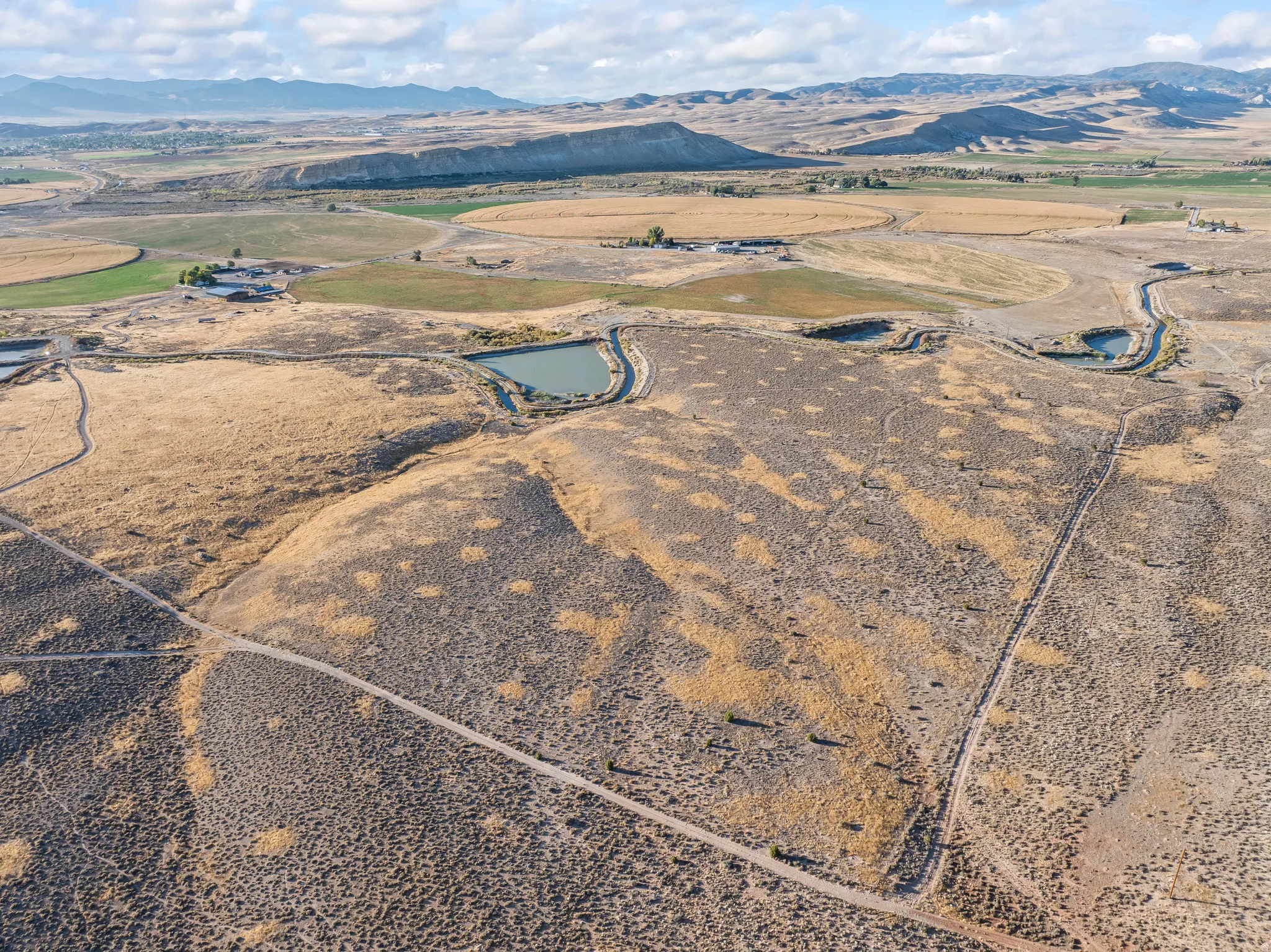 Overview of rural landscape featuring a mountain backdrop