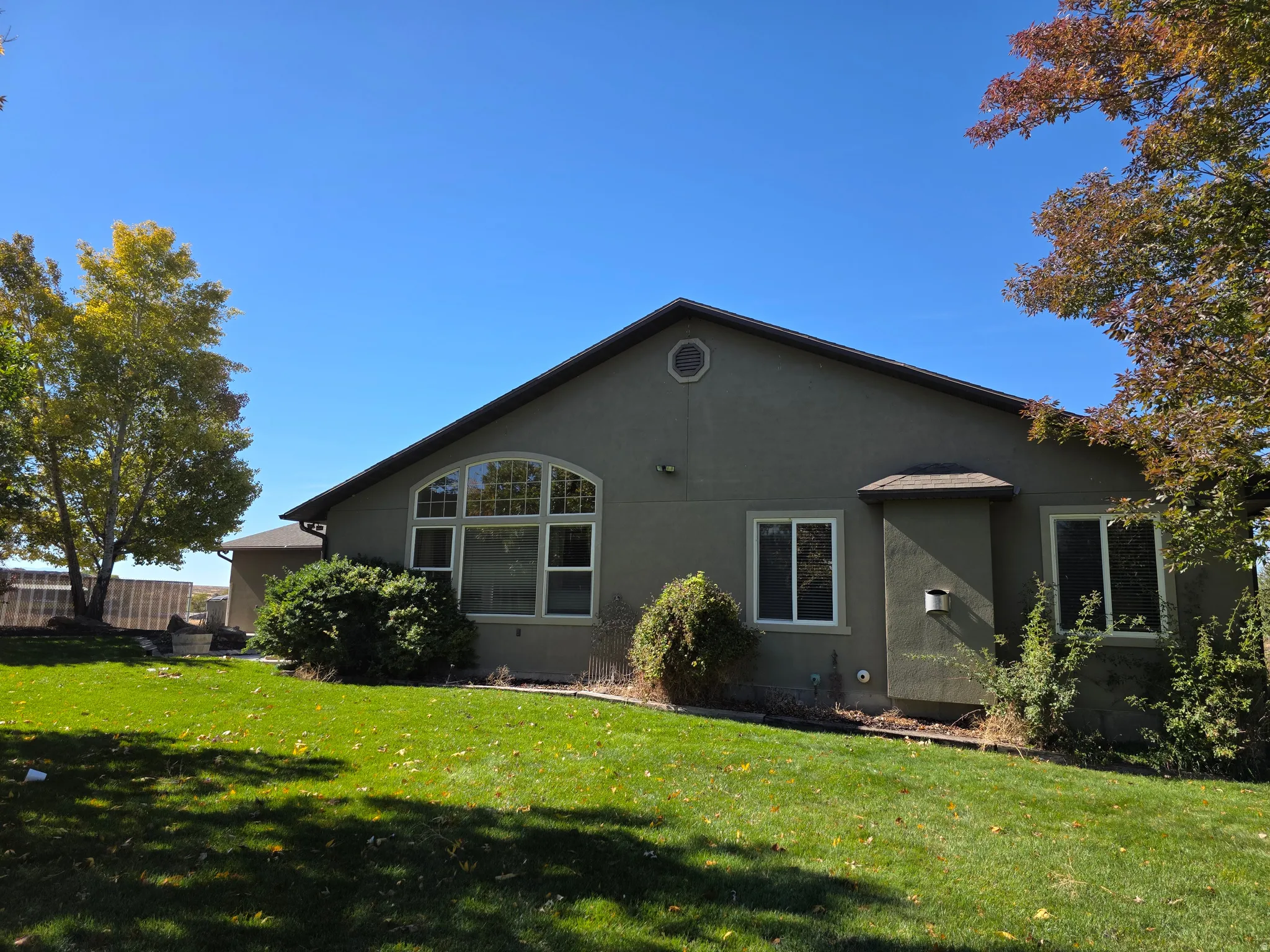 Back of house with stucco siding