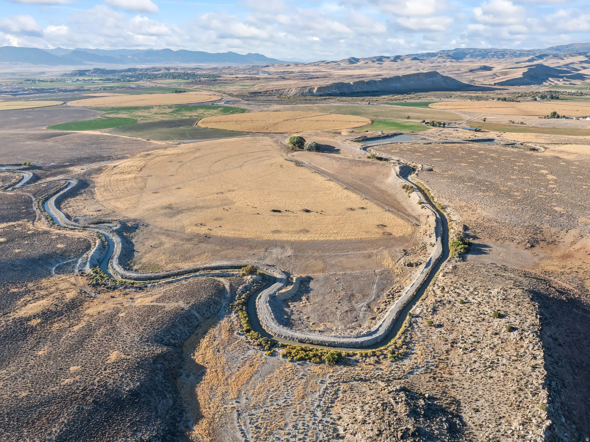 View of property location with a mountain backdrop and rural landscape
