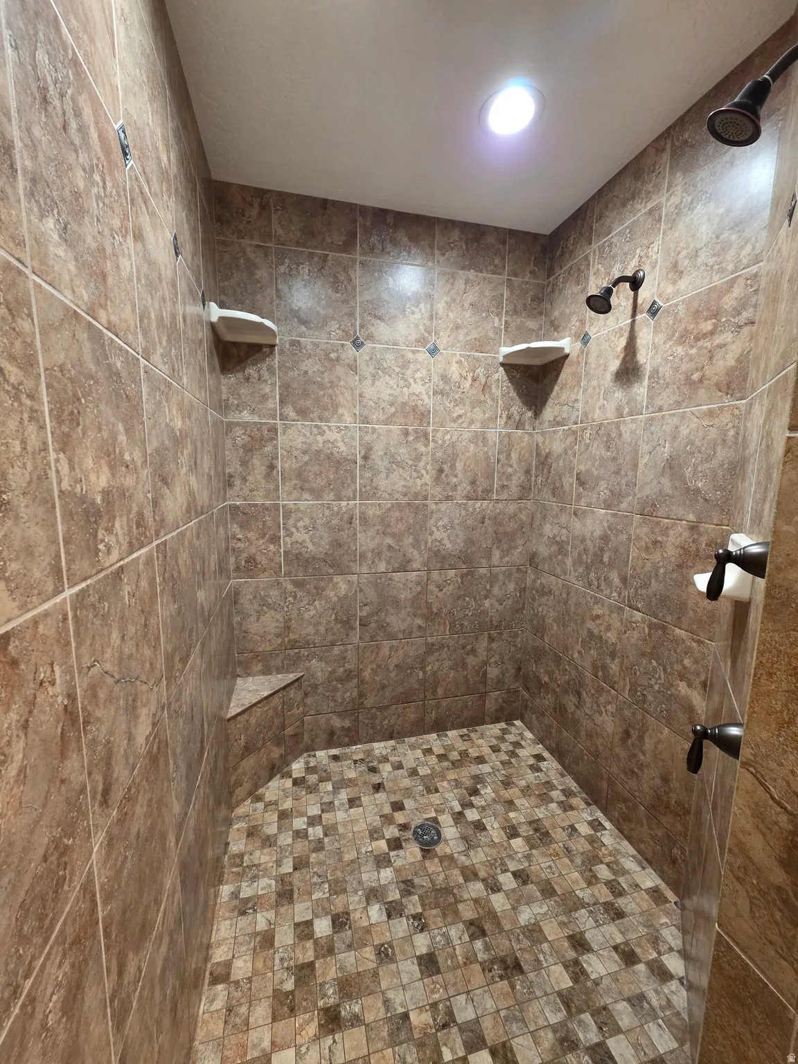 Full bath with tiled shower