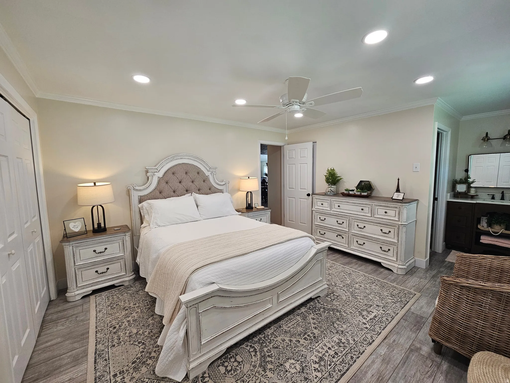 Bedroom featuring crown molding, a closet, dark wood-type flooring, recessed lighting, and a ceiling fan