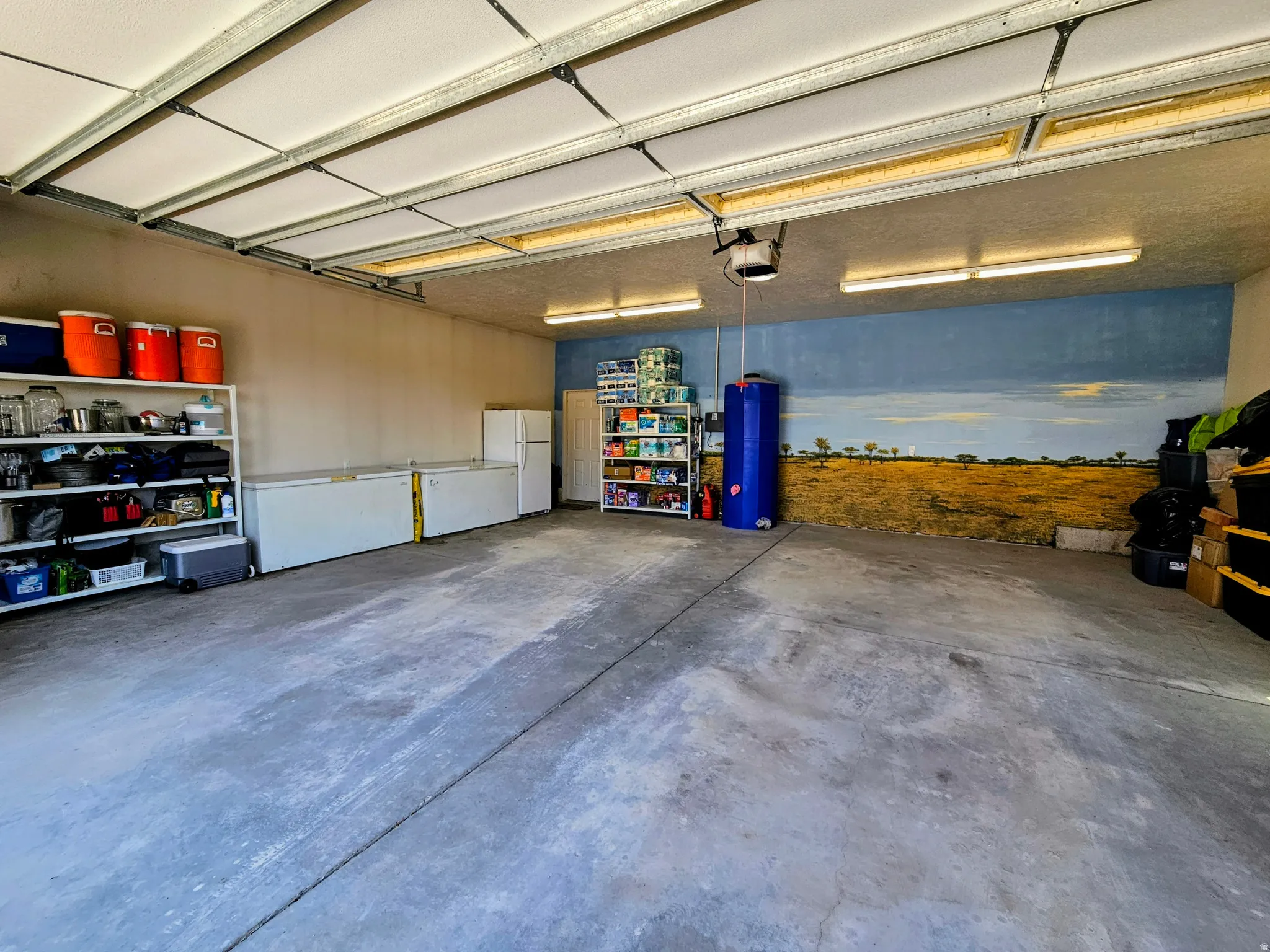 Garage with freestanding refrigerator