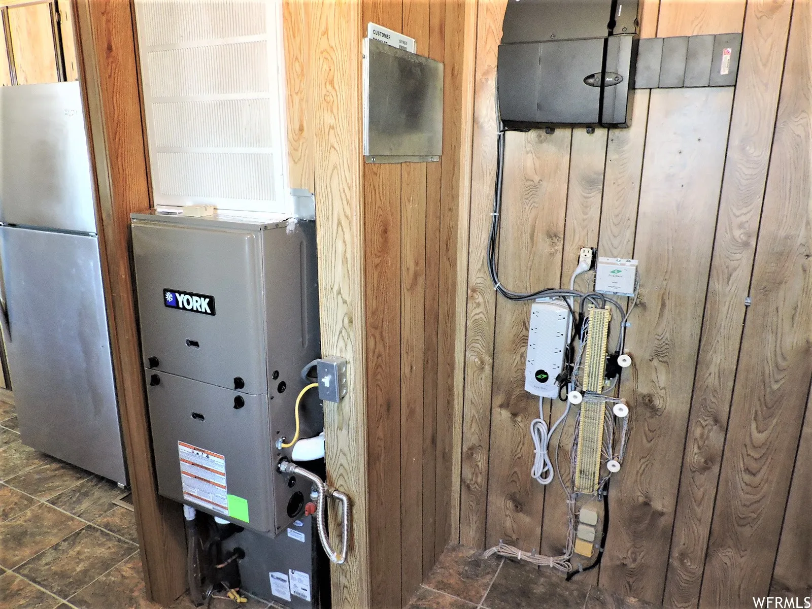 Utility room featuring heating unit