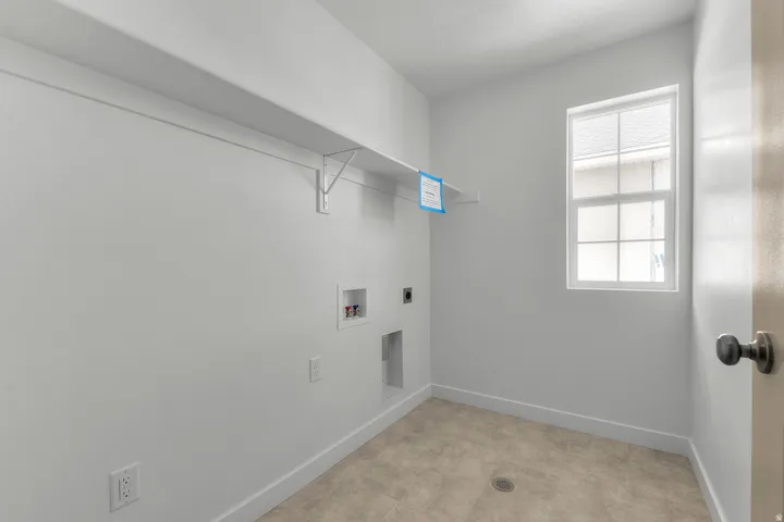 Laundry room with electric dryer hookup and hookup for a washing machine