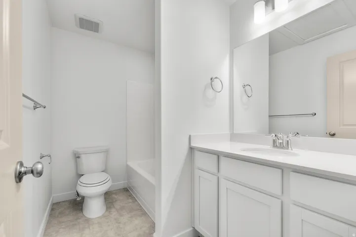 Full bathroom with vanity and shower / washtub combination