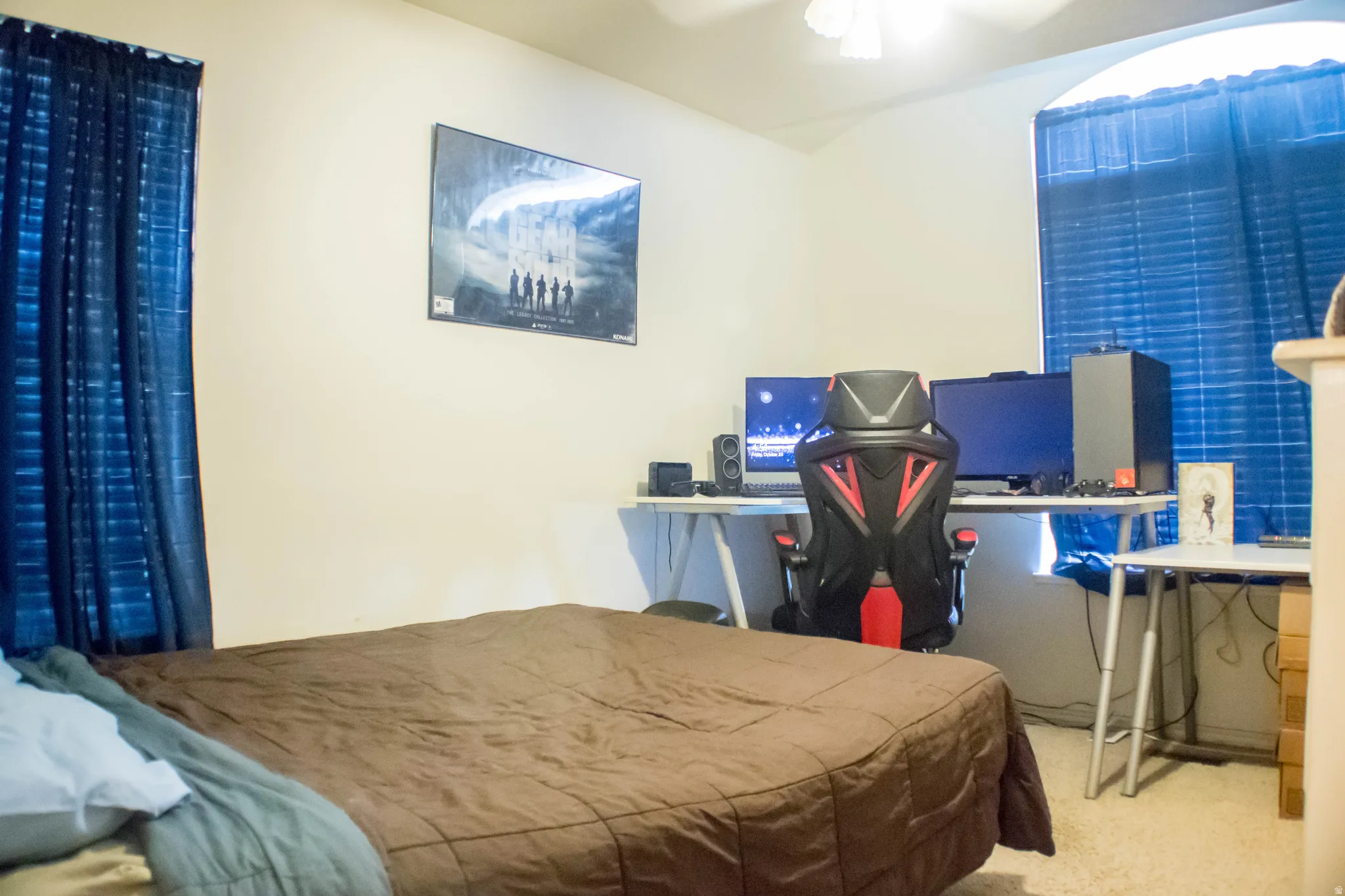 Carpeted bedroom with ceiling fan
