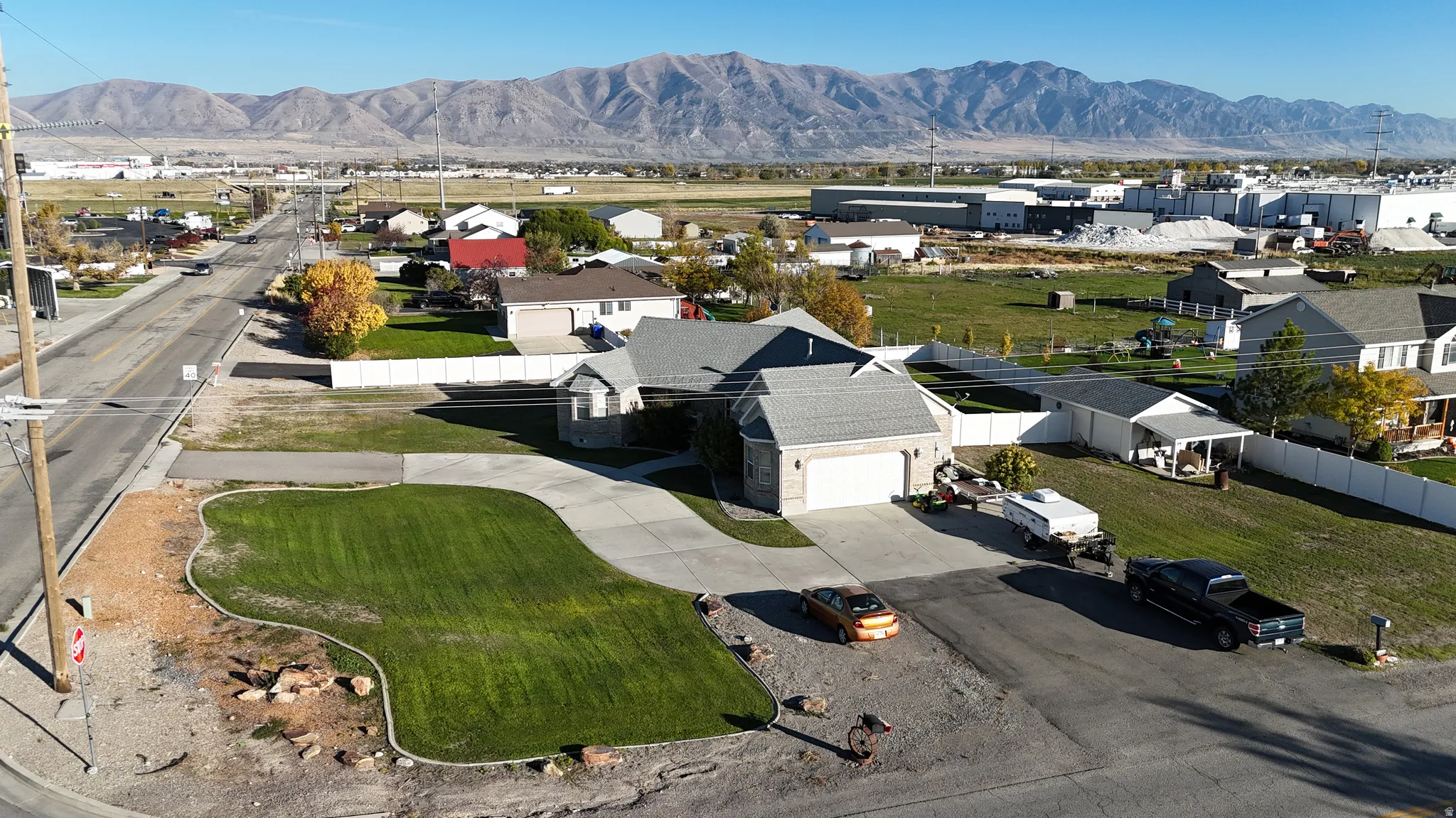 Aerial view of residential area featuring a mountain backdrop