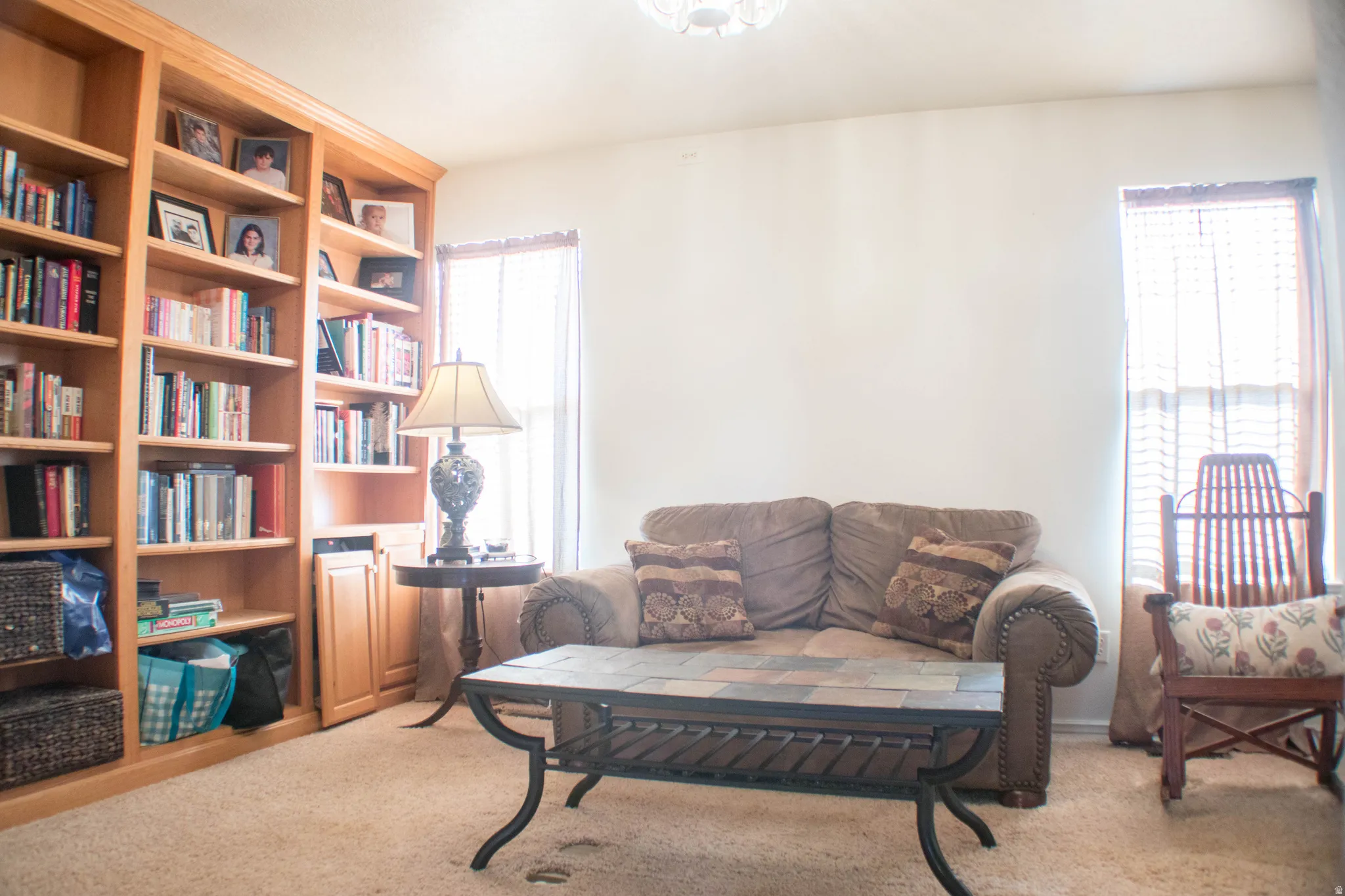 Sitting room featuring light colored carpet