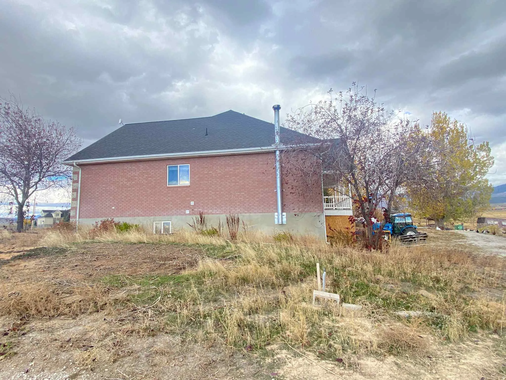 View of side of home with brick siding