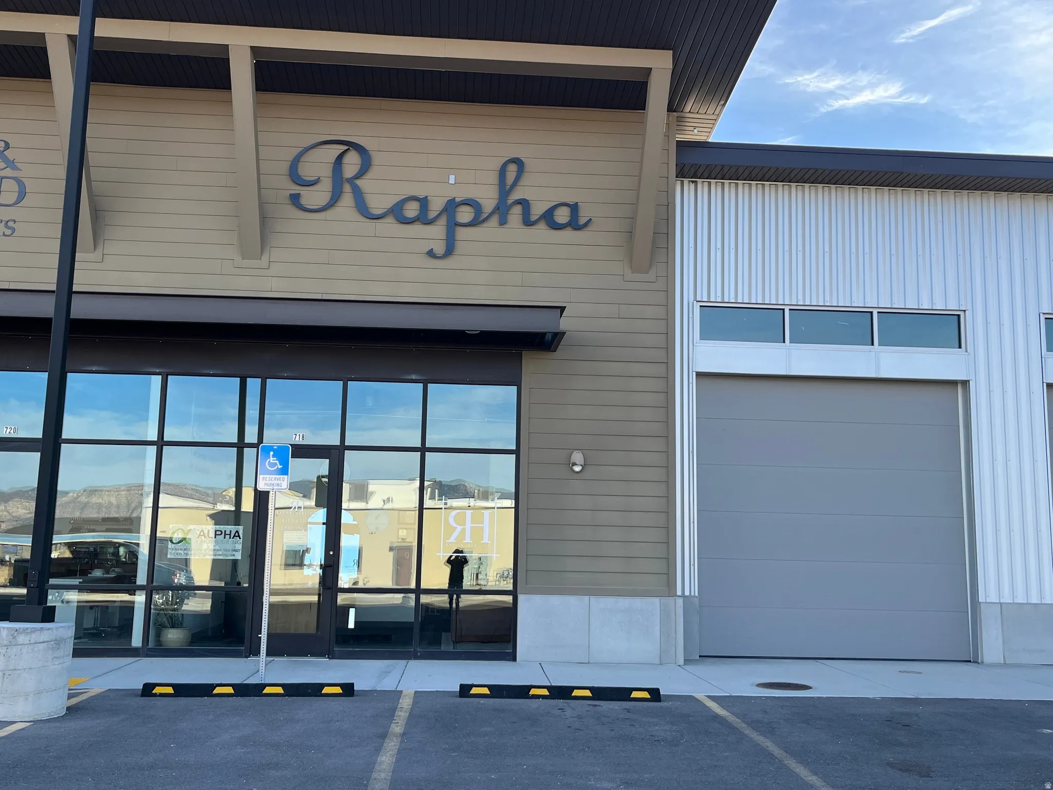 View of commercial location featuring uncovered parking