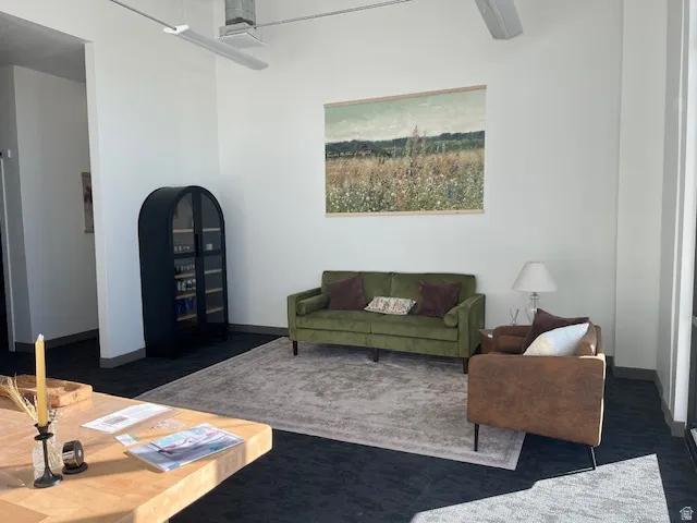 Living area featuring dark carpet