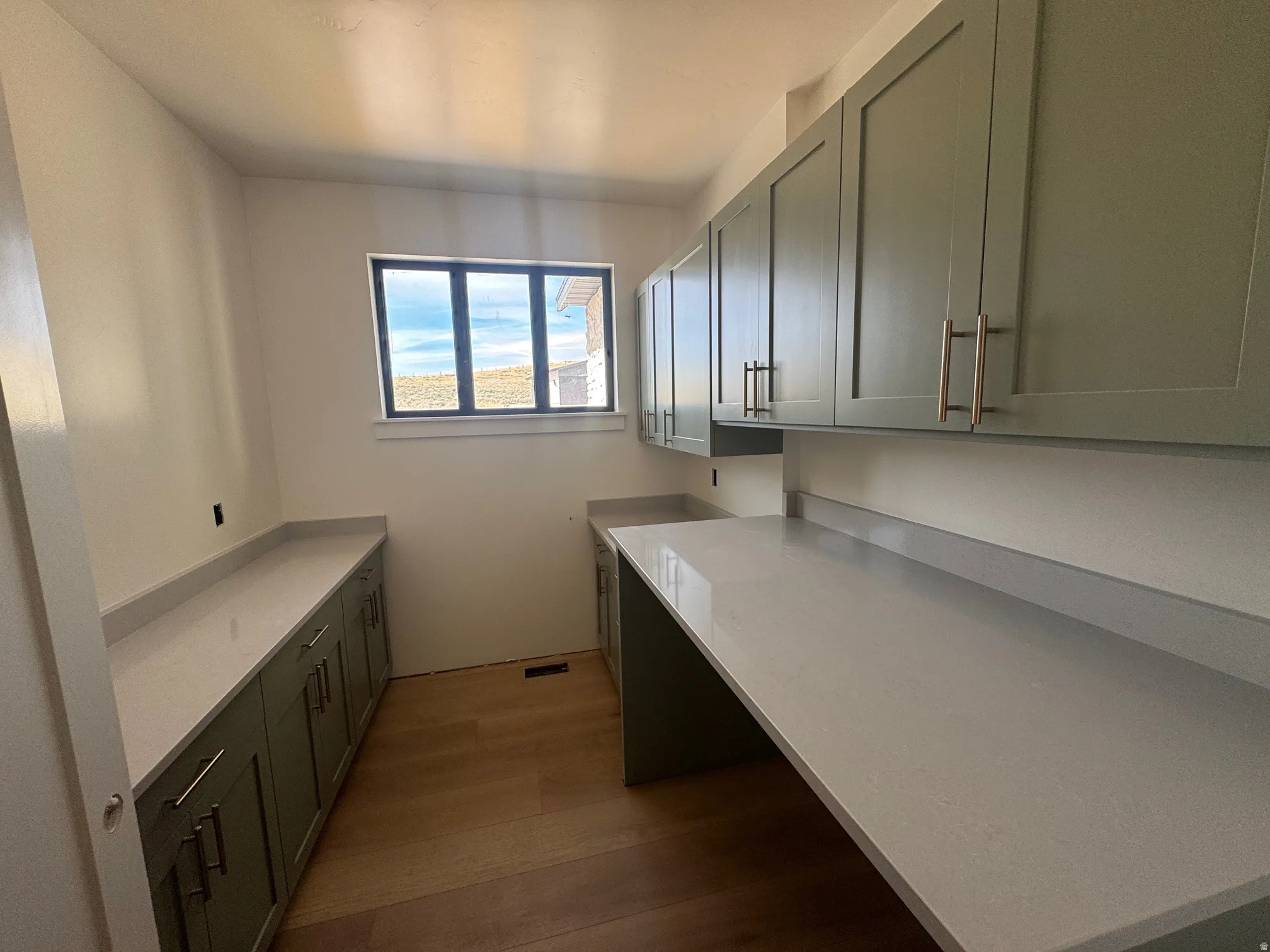 Laundry room featuring dark wood-style floors