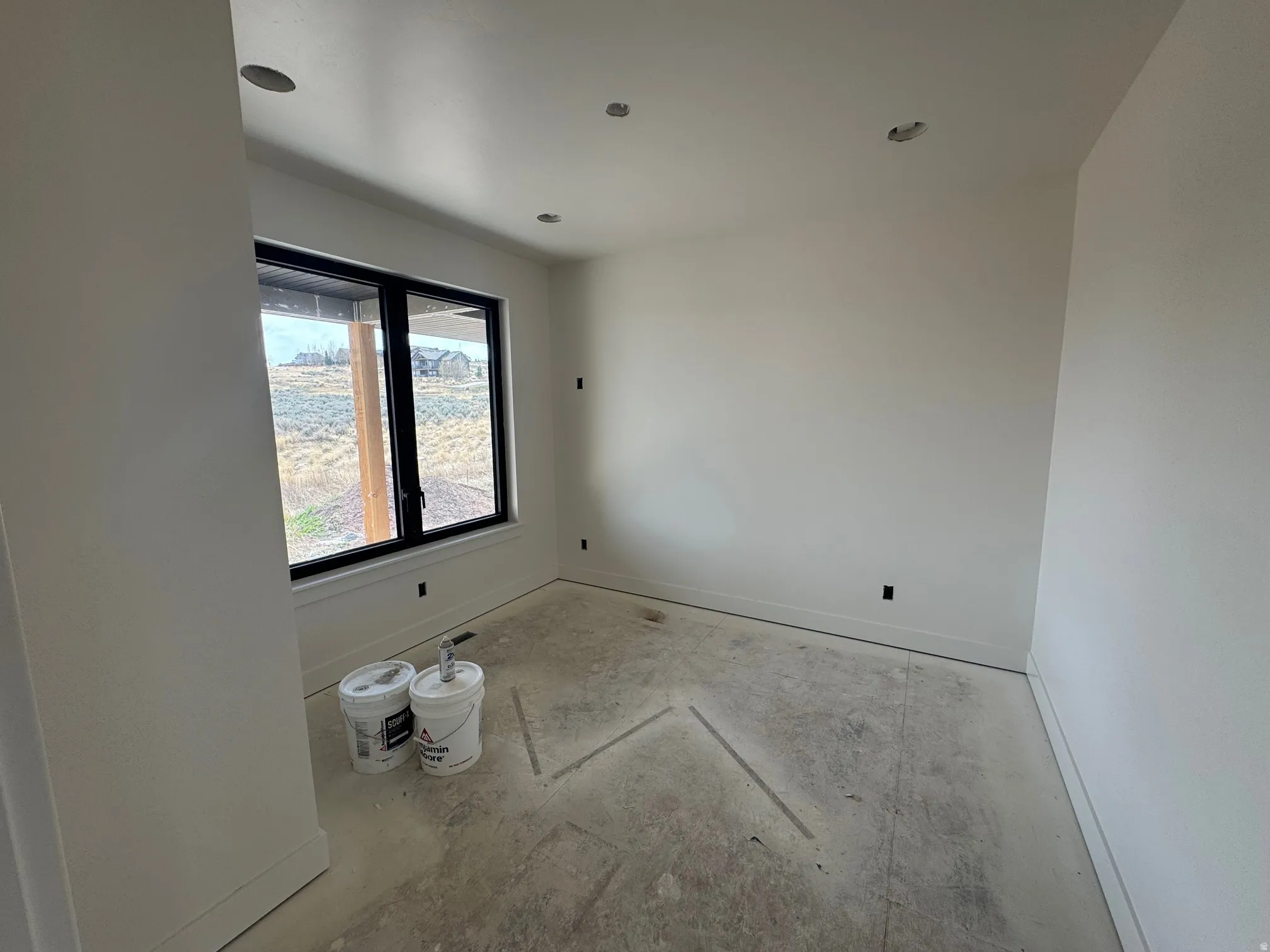 Spare room featuring baseboards