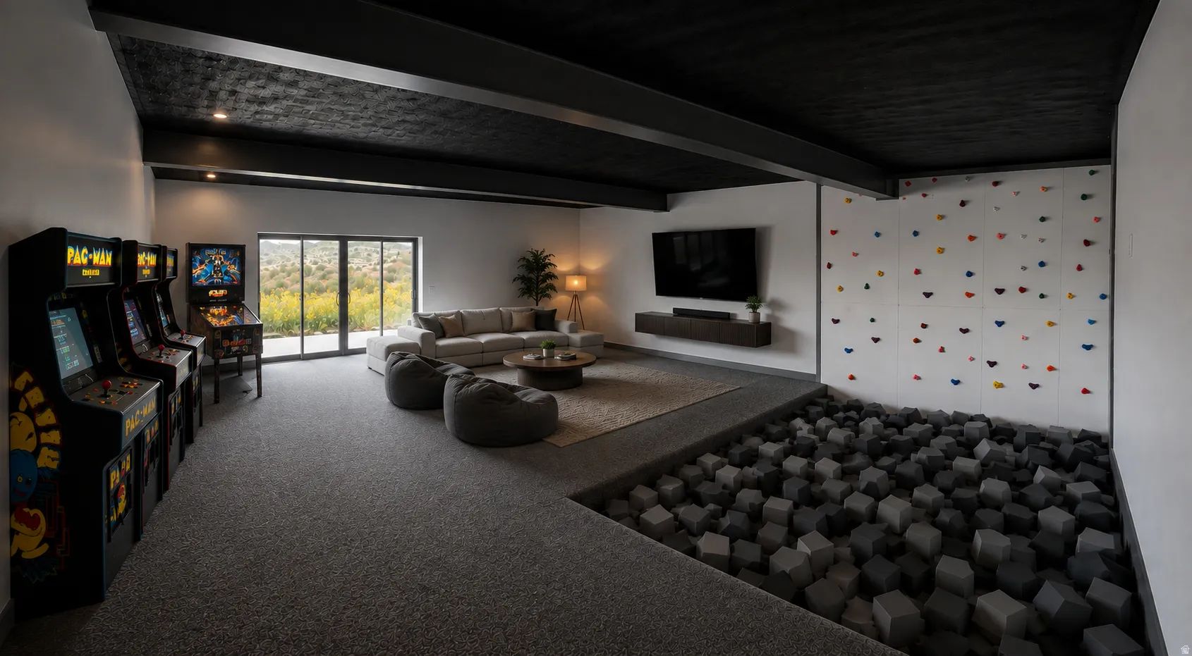 Spacious recreation room featuring a climbing wall, foam pit, and large sliding glass doors