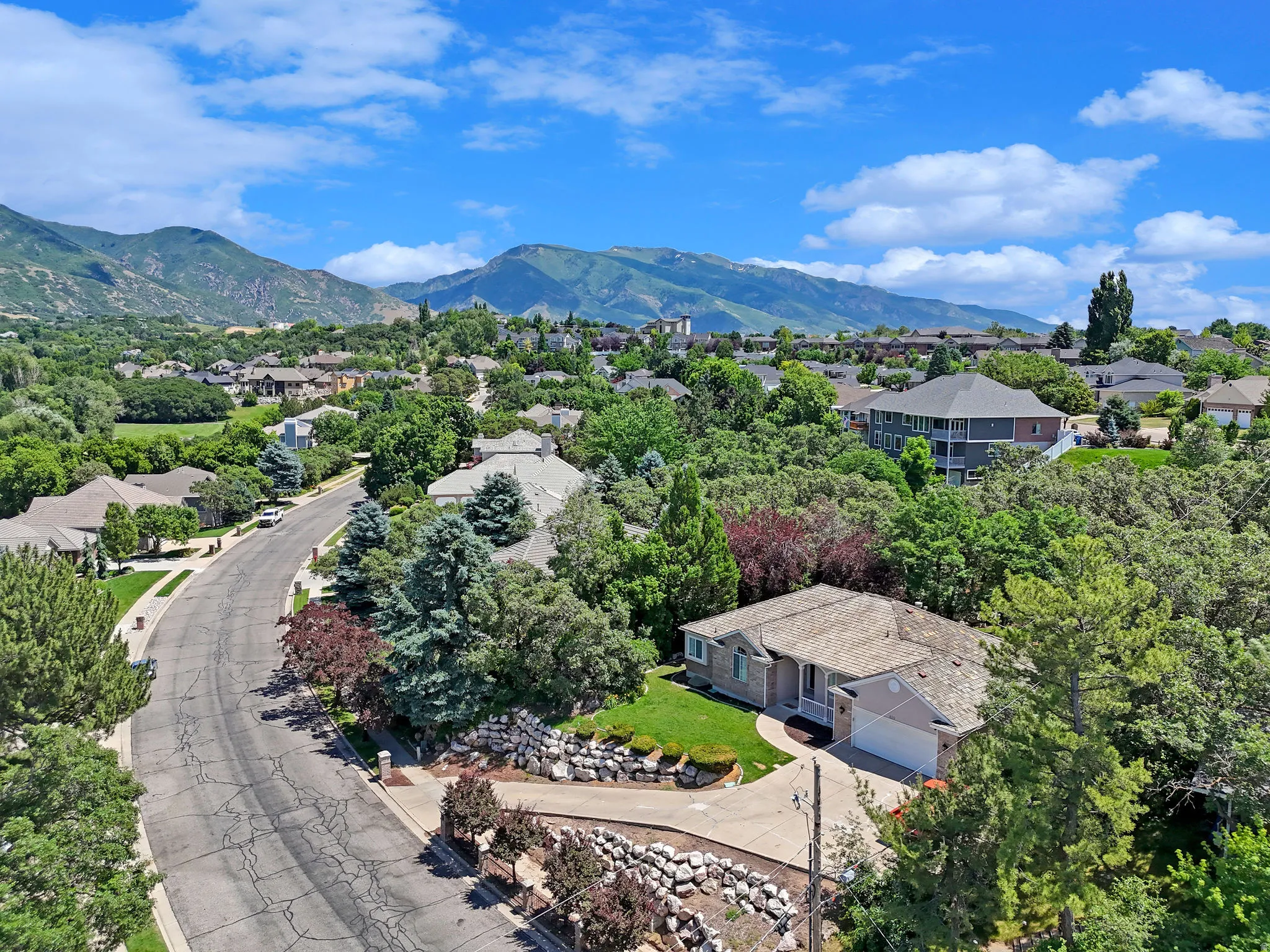 Aerial perspective of suburban area featuring mountains