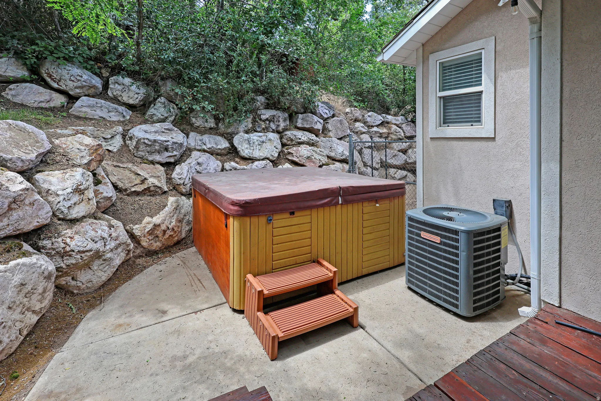 View of patio / terrace with a hot tub
